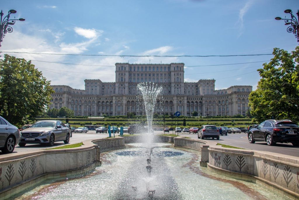 Fountain with the Palace of the Parliament in the background Fountain with the Palace of the Parliament in the background