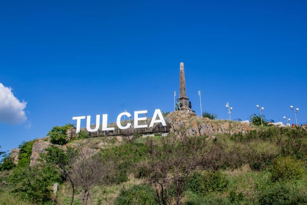 Independence Monument and Tulcea sign Independence Monument and Tulcea sign